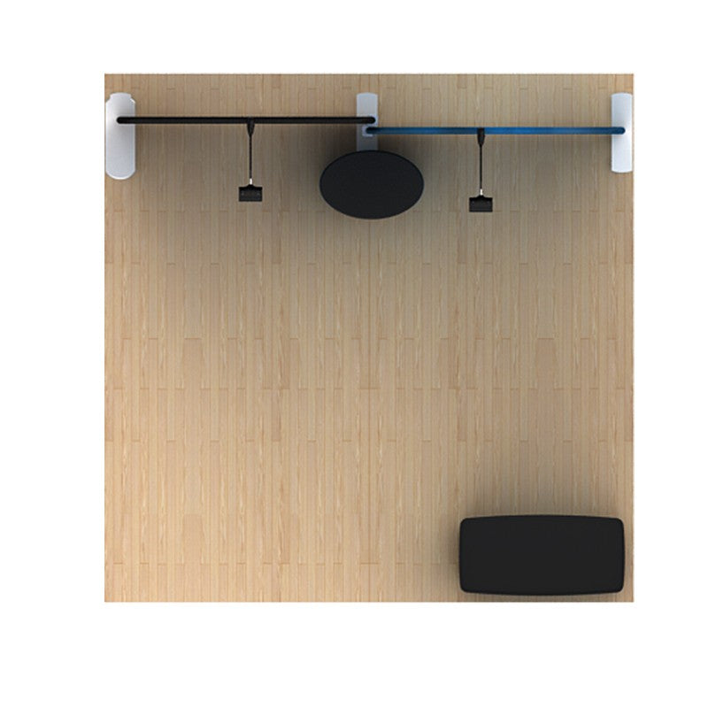 Top-down view of a minimalist room with a wooden floor, featuring sleek lines similar to the 10ft Waveline Media B-Series Scallop Kit B from Affordable Exhibit Displays, with a black bench and horizontal rail enhancing the modern aesthetic.