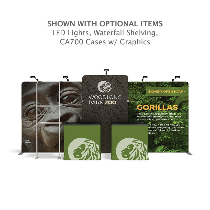 The Woodlong Park Zoo trade show setup features the 20ft Waveline Media M-Series Kit 06 by Affordable Exhibit Displays, displaying gorilla images, green signage, two lion-logo counters, LED lights, shelves, and