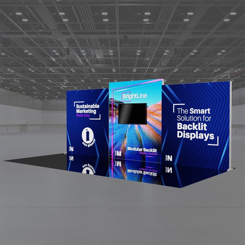 A 20ft BrightLine NMN Kit by Affordable Exhibit Displays showcases vibrant backlit graphics with “Sustainable Marketing,” “BrightLine,” and “The Smart Solution for Backlit Displays” in a spacious, empty trade show hall.
