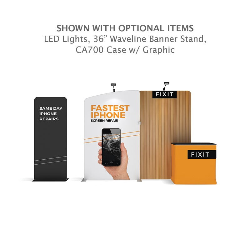 Exhibit booth features the 10ft Waveline Media M-Series Kit 03 from Affordable Exhibit Displays, “FASTEST IPHONE SCREEN REPAIR” and “SAME DAY IPHONE REPAIRS” signs, phone image, LED lights, FIXIT branding, wood graphic panel, and orange counter.