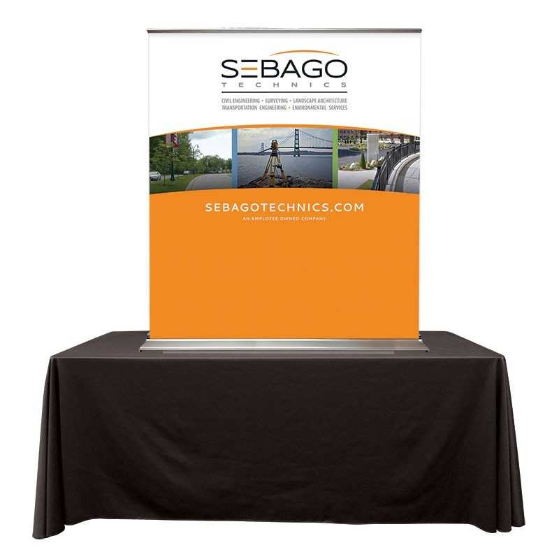 A table top banner stand on a black table on a white background.