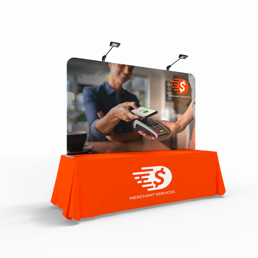 A table top display with a lights and an orange table cover.