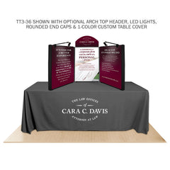 Promoter backlit table top display with images  and arch top and LED lights on white background. 