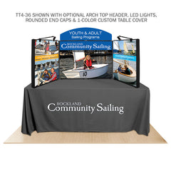 Promoter backlit table top display with images arch top  on white background. 
