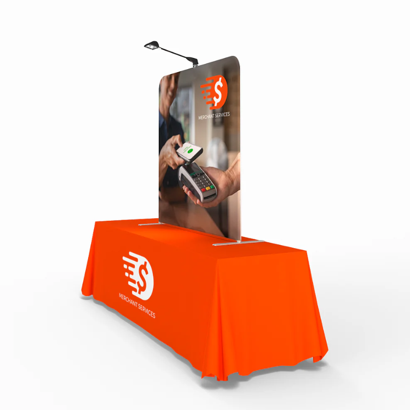 A right side angle of a table top display with lights attached and an orange table cover. 